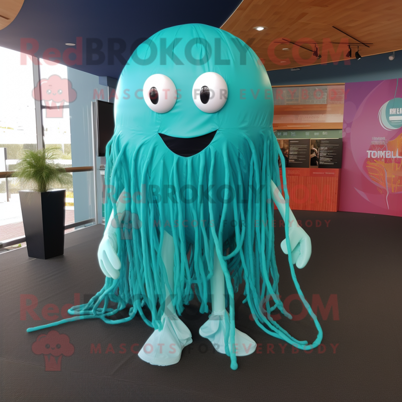 Teal Jellyfish mascot costume character dressed with a Playsuit and Wraps Teal Jellyfish mascot costume character dressed with a Playsuit and Wraps