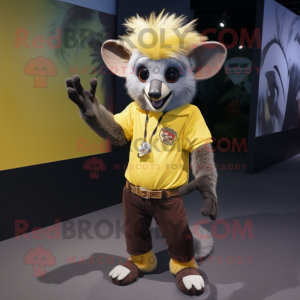 Yellow Aye-Aye mascot costume character dressed with a T-Shirt and Belts