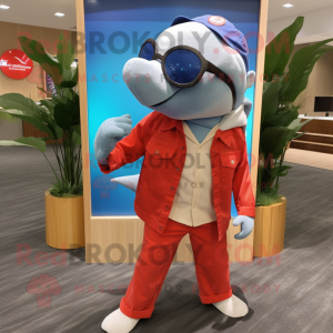 Red Dolphin mascot costume character dressed with a Chambray Shirt and Sunglasses