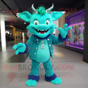 Turquoise Devil mascot costume character dressed with a Cardigan and Bracelets