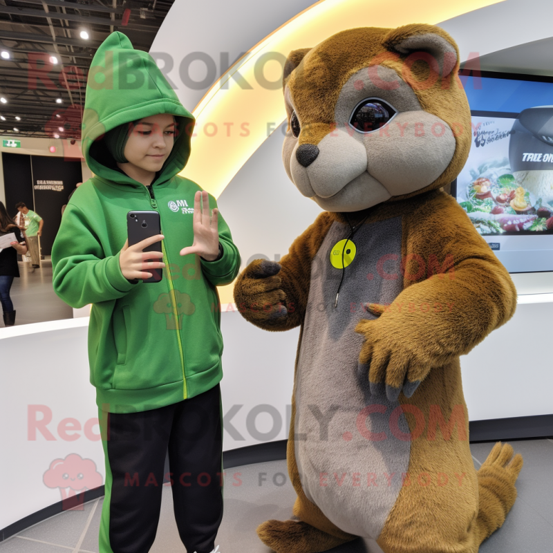 Olive Mongoose mascot costume character dressed with a Hoodie and Smartwatches