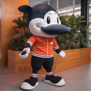 Rust Killer Whale mascot costume character dressed with a Oxford Shirt and Shoe laces