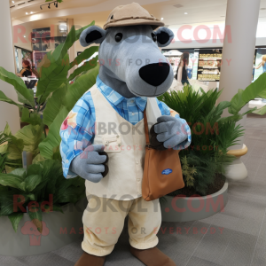 Tan Tapir mascot costume character dressed with a Chambray Shirt and Clutch bags