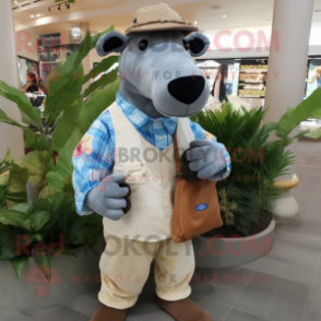 Tan Tapir mascot costume character dressed with a Chambray Shirt and Clutch bags