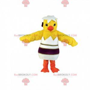 Mascot pollito amarillo con su elegante cáscara de huevo -