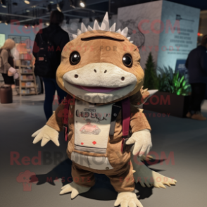 Brown Axolotls mascot costume character dressed with a Graphic Tee and Brooches