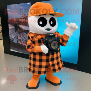 Orange Camera mascot costume character dressed with a Flannel Shirt and Digital watches