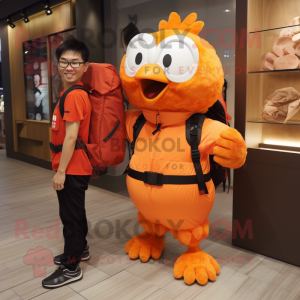 Orange Chicken mascot costume character dressed with a Overalls and Backpacks