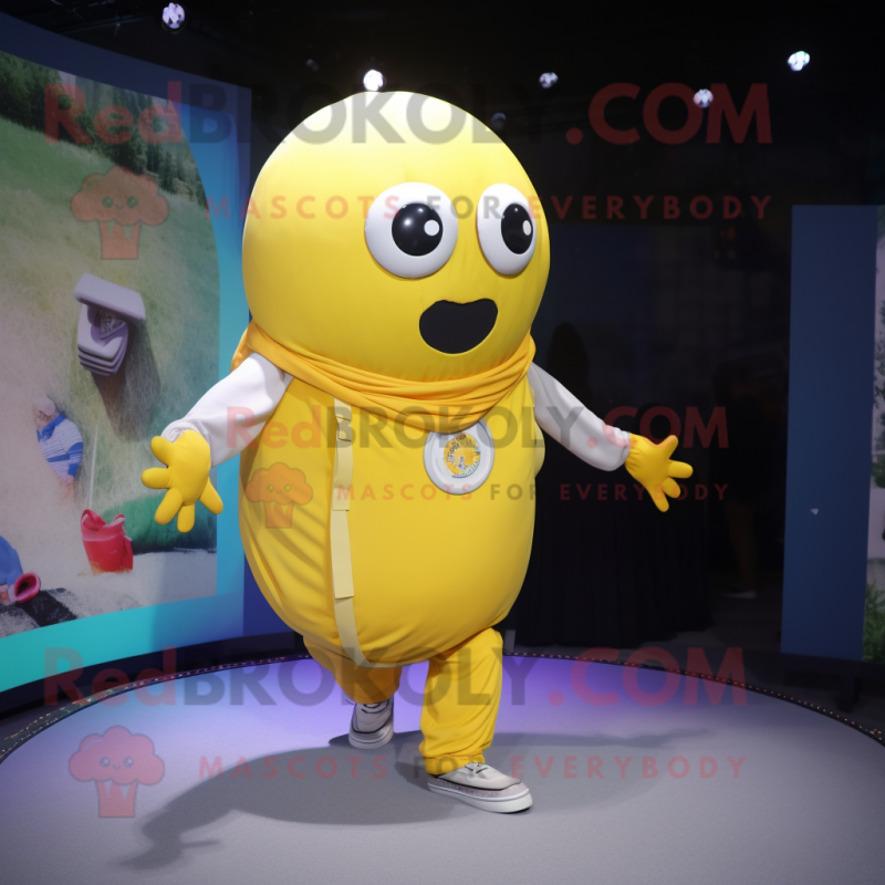 Yellow Human Cannon Ball mascot costume character dressed with a Button-Up Shirt and Scarves Yellow Human Cannon Ball mascot costume character dressed with a Button-Up Shirt and Scarves