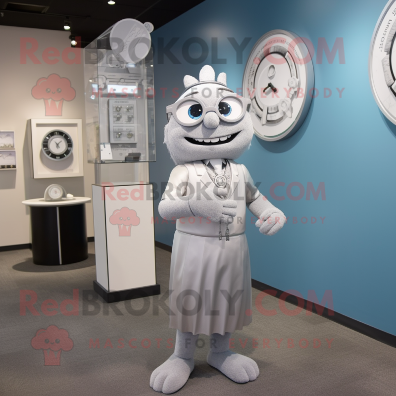 Silver Attorney mascot costume character dressed with a A-Line Dress and Bracelet watches Silver Attorney mascot costume character dressed with a A-Line Dress and Bracelet watches
