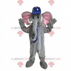 Mascotte elefante grigio con un berretto blu con punti bianchi