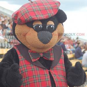 Mascotte van zwarte en bruine beer in Schotse kledij -