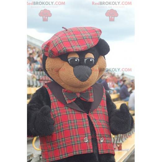 Mascotte orso nero e marrone in abbigliamento scozzese -