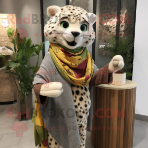 Olive Cheetah mascot costume character dressed with a Cardigan and Shawls