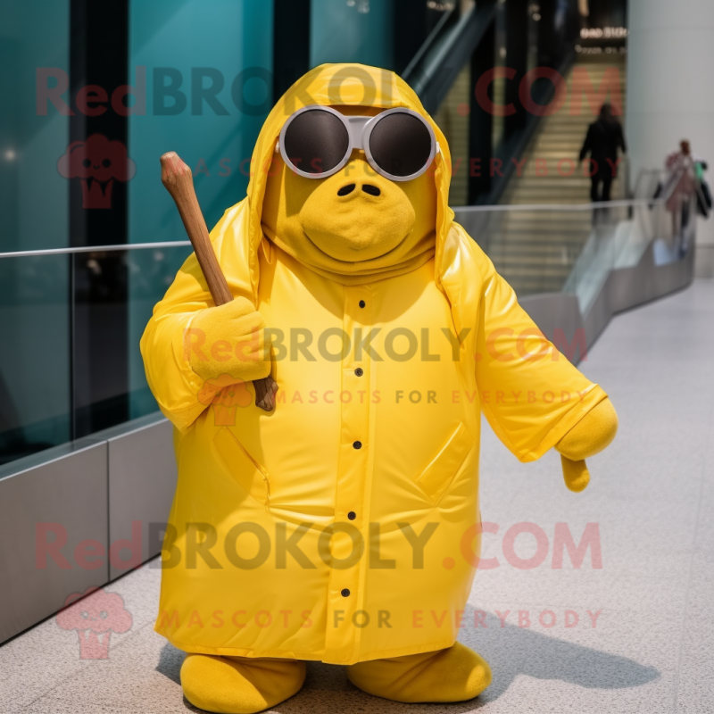 Yellow Walrus mascot costume character dressed with a Raincoat and Sunglasses Yellow Walrus mascot costume character dressed with a Raincoat and Sunglasses