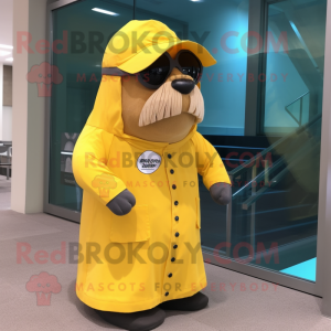 Yellow Walrus mascot costume character dressed with a Raincoat and Sunglasses
