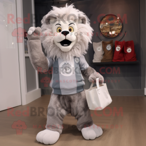 Silver Tamer Lion mascot costume character dressed with a Jeggings and Tote bags