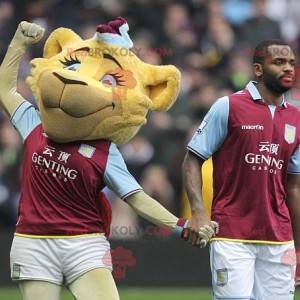 Mascote tigre amarelo bebê em roupas esportivas - Redbrokoly.com