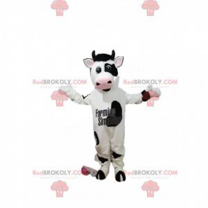 Mascota de vaca en blanco y negro con una gran sonrisa -