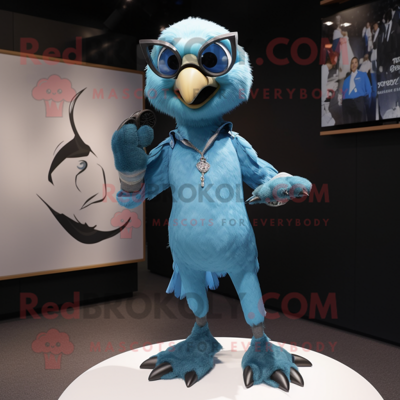 Cyan Falcon mascot costume character dressed with a Skinny Jeans and Cufflinks Cyan Falcon mascot costume character dressed with a Skinny Jeans and Cufflinks