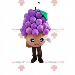 Mascotte de petit bonhomme rond avec une grappe de raisin -