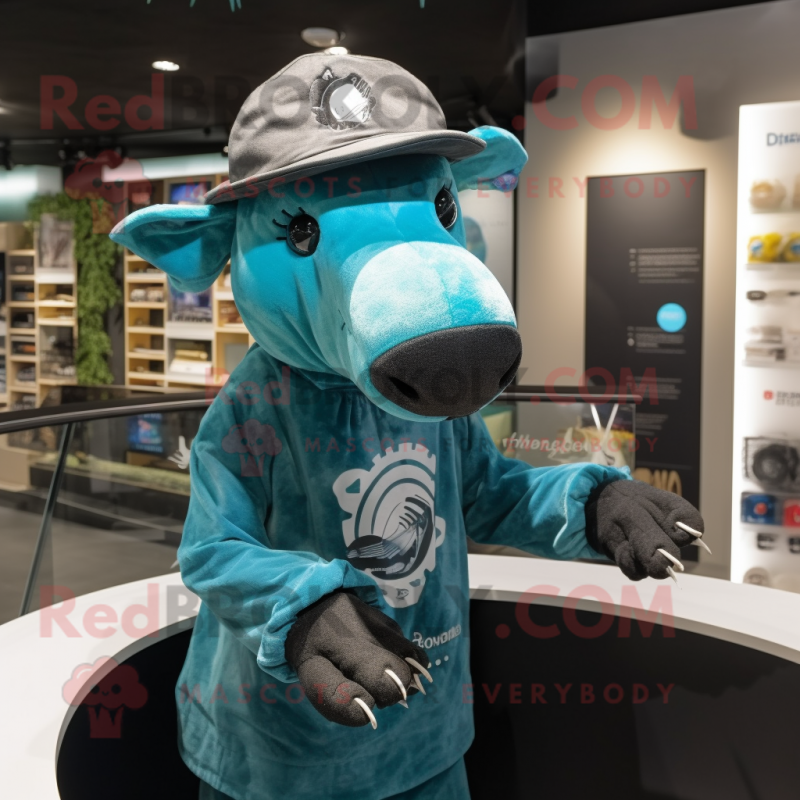 Turquoise Tapir mascot costume character dressed with a Graphic Tee and Hat pins Turquoise Tapir mascot costume character dressed with a Graphic Tee and Hat pins