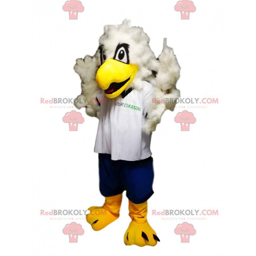 Mascotte d'aigle royal avec un maillot blanc et un short bleu -