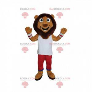 Mascota divertida del león con ropa deportiva blanca y roja -