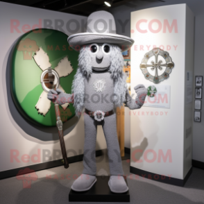 Silver Celtic Cross mascot costume character dressed with a Skinny Jeans and Hat pins