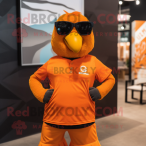 Orange Crow mascot costume character dressed with a Graphic Tee and Sunglasses