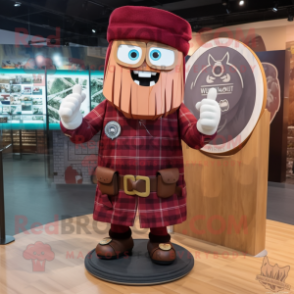 Maroon Celtic Shield mascot costume character dressed with a Flannel Shirt and Hat pins