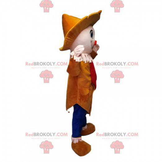 Mascotte de clown avec un petit nez orange et un joli chapeau