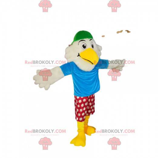 Mascotte d'aigle blanc rigolo avec un short rouge à pois blancs