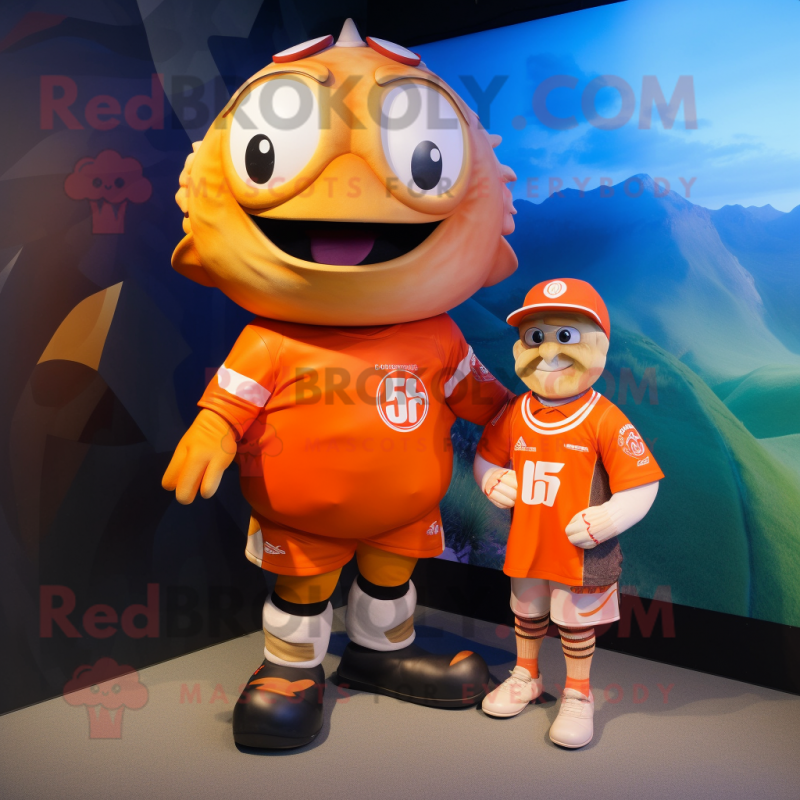 Orange Cod mascot costume character dressed with a Rugby Shirt and Wraps Orange Cod mascot costume character dressed with a Rugby Shirt and Wraps