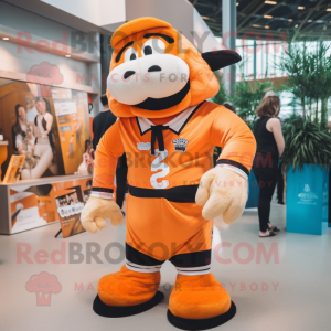 Orange Cod mascot costume character dressed with a Rugby Shirt and Wraps