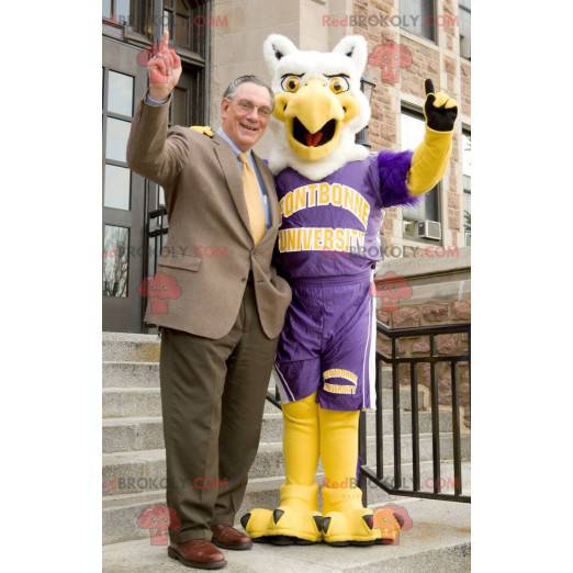 Mascotte d'oiseau d'aigle blanc et jaune en tenue de sport -