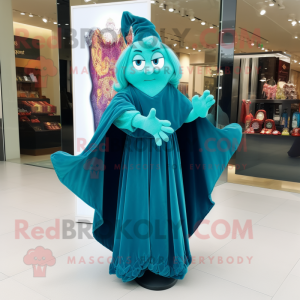 Turquoise Witch mascot costume character dressed with a Evening Gown and Scarves