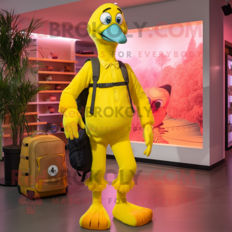 Yellow Flamingo mascot costume character dressed with a Capri Pants and Backpacks