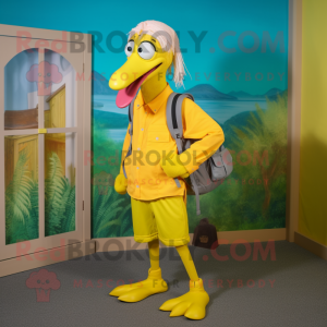 Yellow Flamingo mascot costume character dressed with a Capri Pants and Backpacks