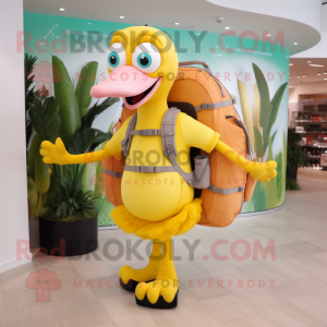 Yellow Flamingo mascot costume character dressed with a Capri Pants and Backpacks