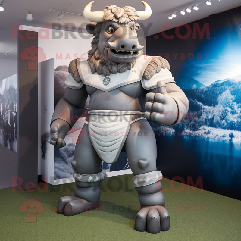 Silver Minotaur mascot costume character dressed with a Rugby Shirt and Wraps