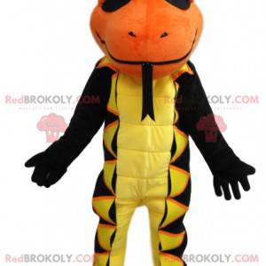 Mascotte salamandra gialla e nera con una testa arancione -