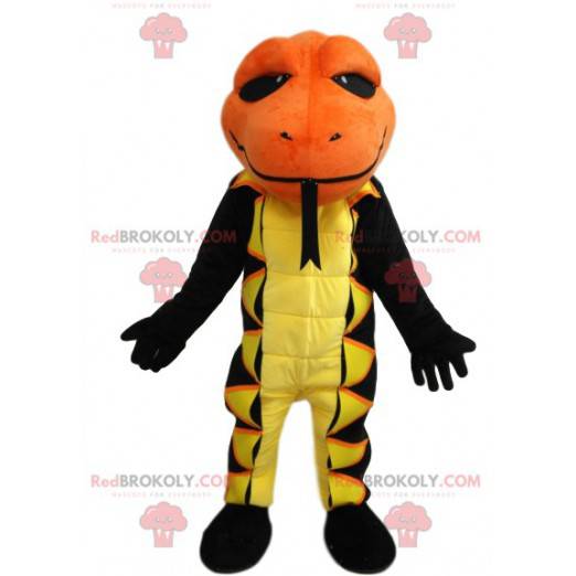 Mascotte salamandra gialla e nera con una testa arancione -
