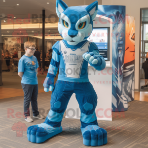 Blue Bobcat mascot costume character dressed with a Graphic Tee and Foot pads