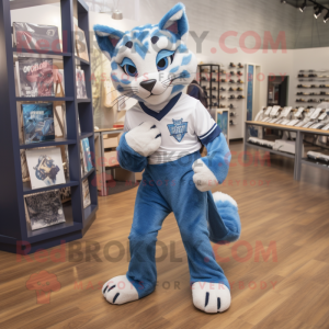 Blue Bobcat mascot costume character dressed with a Graphic Tee and Foot pads