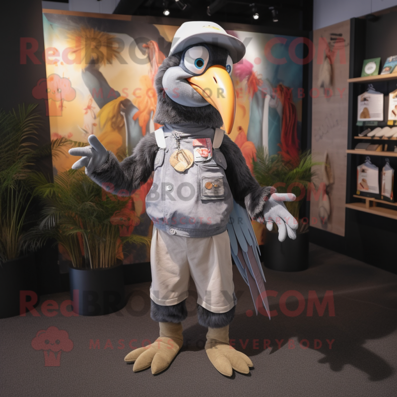 Gray Toucan mascot costume character dressed with a Romper and Caps Gray Toucan mascot costume character dressed with a Romper and Caps