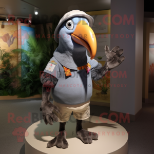 Gray Toucan mascot costume character dressed with a Romper and Caps