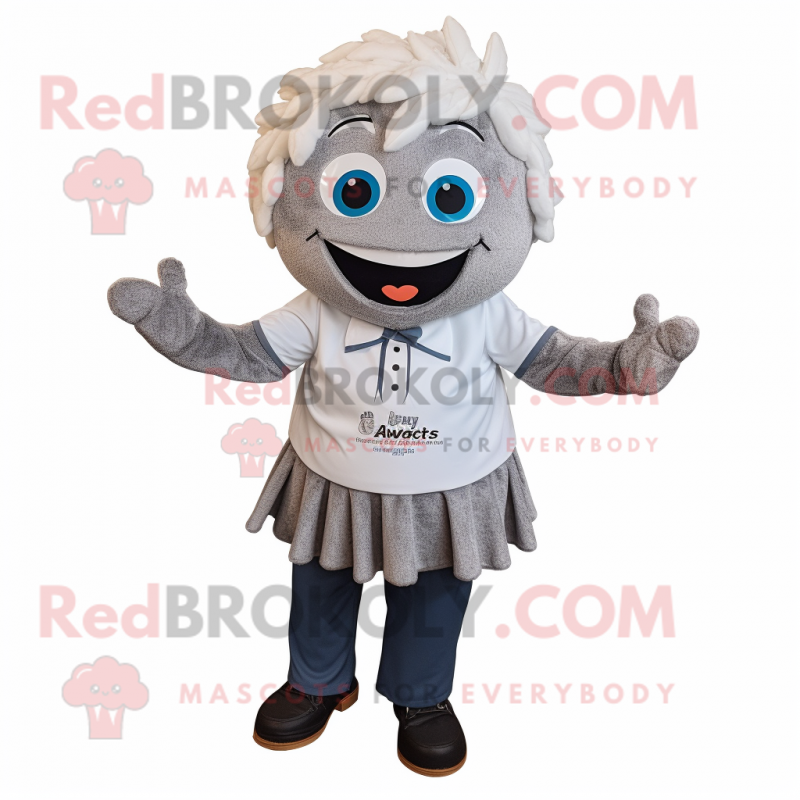 Silver Cupcake mascot costume character dressed with a Button-Up Shirt and Shawl pins