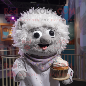 Silver Cupcake mascot costume character dressed with a Button-Up Shirt and Shawl pins