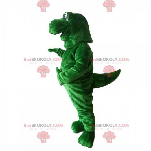 Mascote gigante de dinossauro verde com olhos protuberantes -